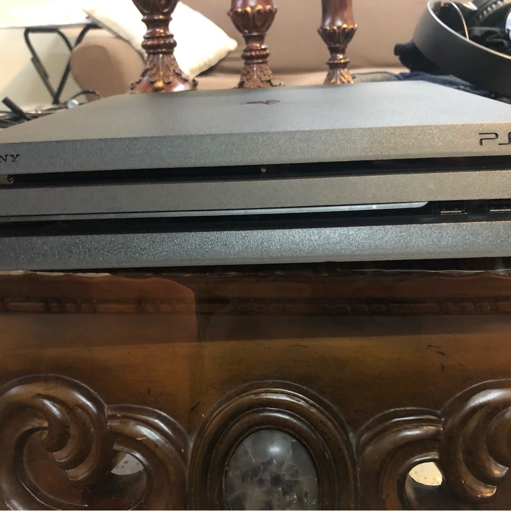 This ps4 pro comes with a controller and controller wall charger.